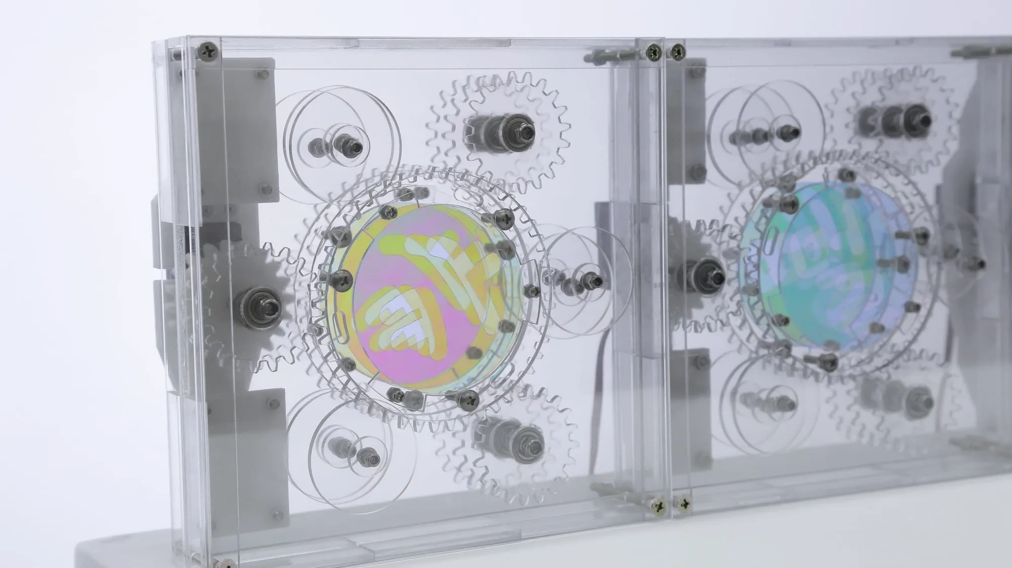 Chameleon — polarizing and OPP films on acrylic gears